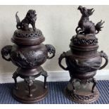 A good large pair of Japanese urns of shaped form with lift-off covers to circular bases.