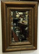 A gilt framed mirror.