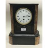 A large slate mantle clock with white enamelled dial.