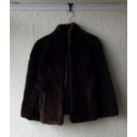 One sheepskin coat and one leather coat together with one other vintage coat.