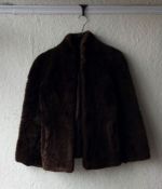 One sheepskin coat and one leather coat together with one other vintage coat.