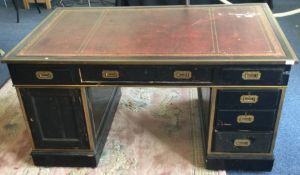 A good ebony and brass mounted twin pedestal desk.