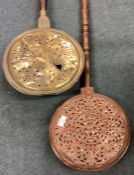 A good Antique copper hinged topped warming pan together with one other.