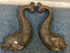 A pair of heavy Antique brass brackets in the form of sea creatures.