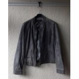 One leather coat together with one other vintage coat. Size 40.