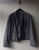 One leather coat together with one other vintage coat. Size 40.