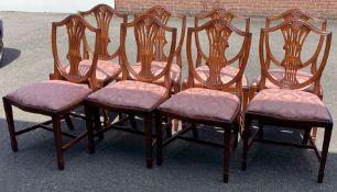 A set of eight reproduction chairs.