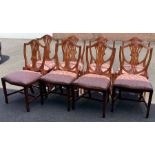 A set of eight reproduction chairs.