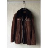 One sheepskin coat and two leather coats together with one vintage dress.