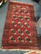 A good Antique red ground rug.