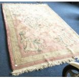 A heavy pink ground rug decorated with dragons. Ap