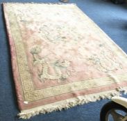 A heavy pink ground rug decorated with dragons. Ap