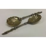 A good pair of cast silver gilt spoons. London. By H&H.