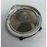 A circular silver frame with swag decoration. Birmingham 1911. By Henry Matthews.