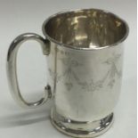 A silver christening mug engraved with swags. Birmingham 1929.