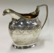 A Georgian bright-cut silver jug. London 1809.
