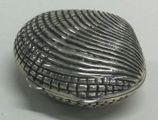 A silver box in the form of a shell. Marked to interior.