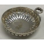 A small silver bleeding bowl of fluted design. Lon