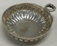 A small silver bleeding bowl of fluted design. Lon
