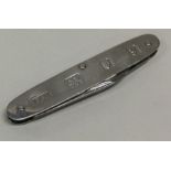 A heavy silver travelling knife. London 1998. By L