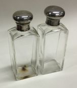 A good pair of silver mounted bottles and covers. London. By JD.