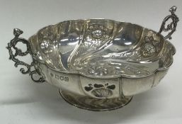 A swirl mounted bonbon dish with chased decoration