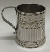 A Queen Anne Britannia Standard silver reeded mug.