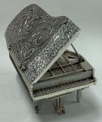 A Sterling silver heavy model of a piano.