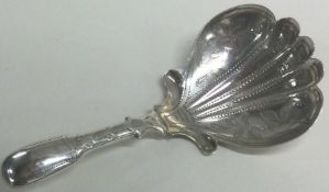 A George III silver caddy spoon. Birmingham 1826.