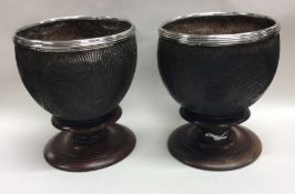 A pair of silver mounted coconut cups.