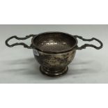 A good heavy silver tea strainer on stand.