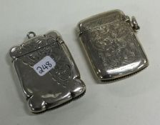 A hinged top silver vesta case together with one other.