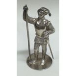 A heavy silver figure of a soldier.