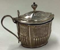 An 18th Century fluted silver mustard pot. London 1798.