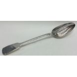 A solid George III silver divider basting spoon. London 1829. By John Hawkins.