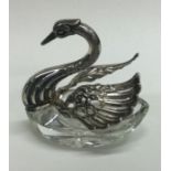 A silver and glass swan box bearing import marks.