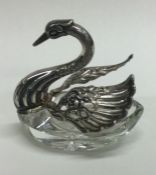 A silver and glass swan box bearing import marks.