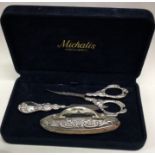 A chased silver manicure set.