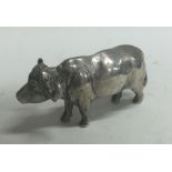 A heavy silver figure of a cow. Probably by Patrick Mavros?
