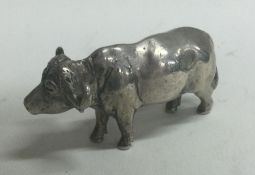 A heavy silver figure of a cow. Probably by Patrick Mavros?