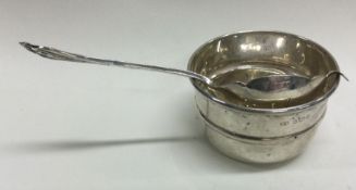 A silver tea strainer on stand. Sheffield 1959. By Emile Viner.