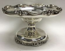 A good heavy stylish silver sweet dish of shaped form with scroll decoration.