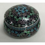 A large silver and enamelled box.