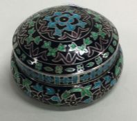 A large silver and enamelled box.