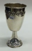 An unusual large silver goblet with floral decoration.
