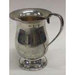 A silver christening mug. Birmingham 1977. By B&Co.