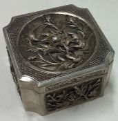 A Chinese silver chased box embossed with flowers. Marked to base.