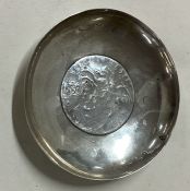 WANG HING: A Chinese silver dish with coin centre, the coin dated 1789.