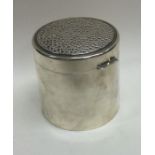 A Contemporary silver hinged tea caddy of hammered design with silver gilt interior. London 1986.