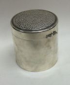 A Contemporary silver hinged tea caddy of hammered design with silver gilt interior. London 1986.